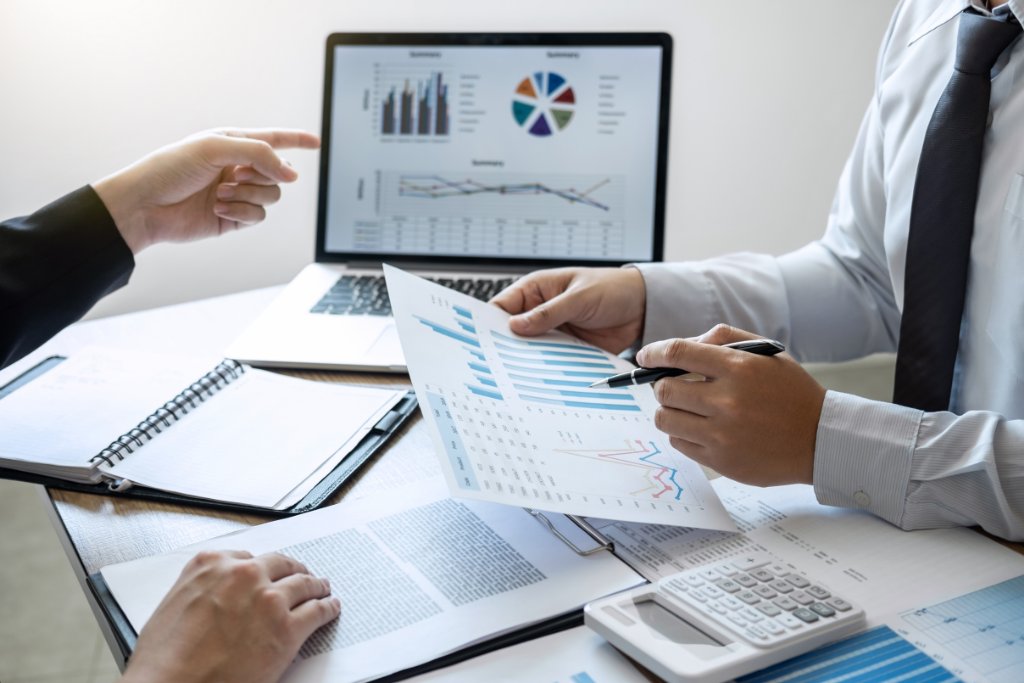 Professional working with business analytics dashboard and data visualizations